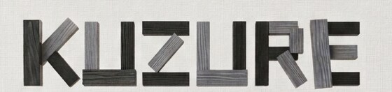 KUZURE — the wordmark, each letter built from charred and silvered wooden blocks